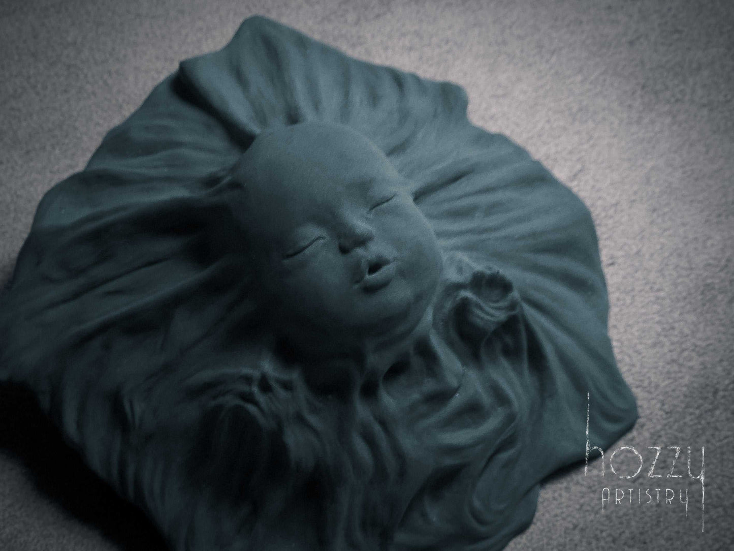 The Veiled BabyThe design takes inspiration from the timeless marble sculpture "The Veiled Virgin" by Italian artist Giovanni Strazza. The sculpture portrays a baby's face with a tHOZZY Artistry StoreHOZZY Artistry Store